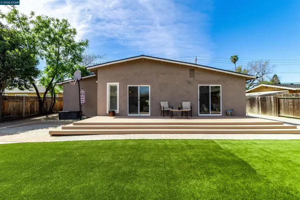 a view of a house with a yard and plants