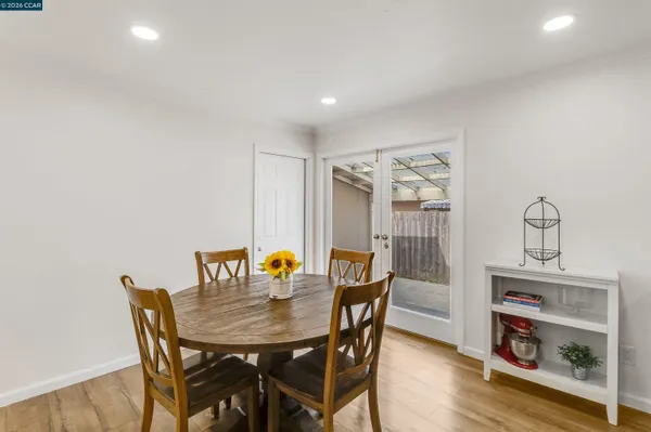 a view of a dining room with furniture and wooden floor