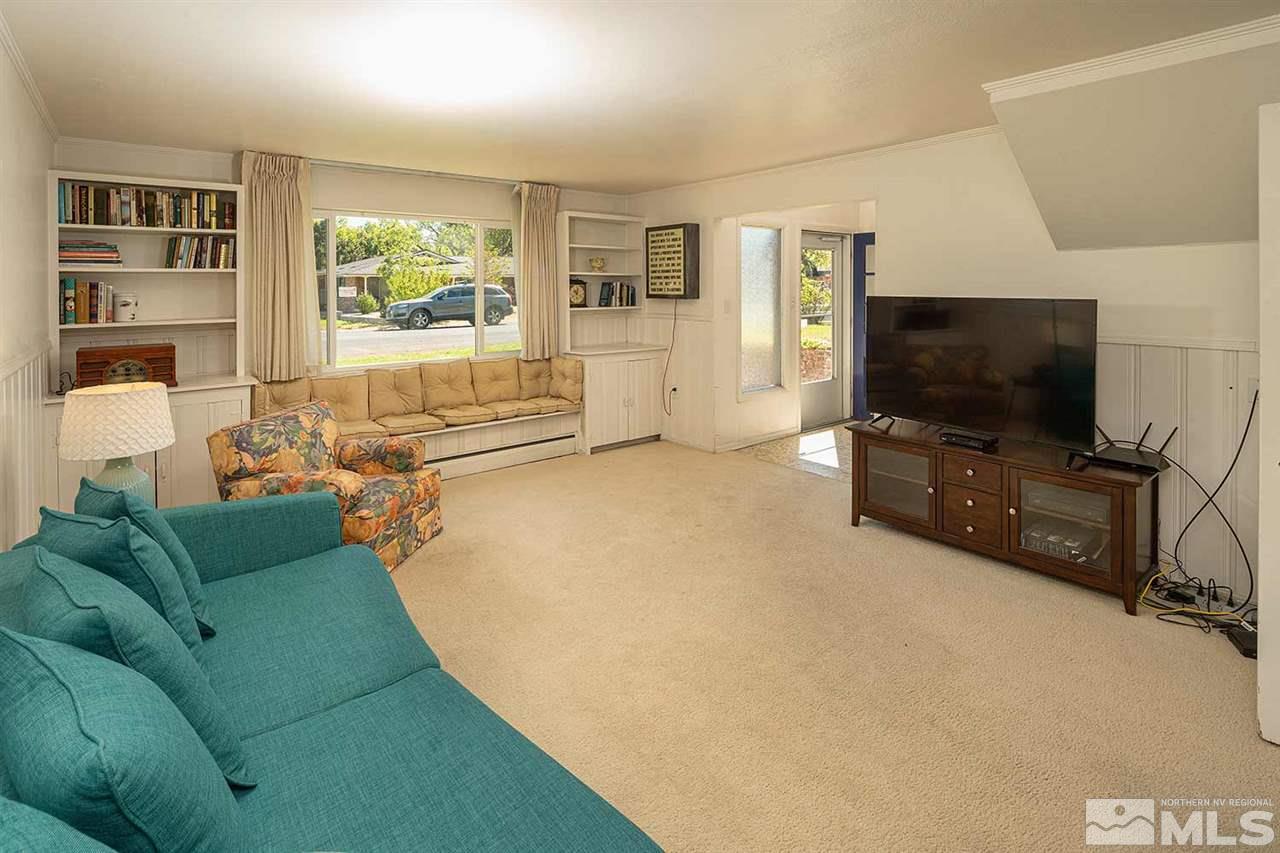 1425 Marsh Avenue Reno, NV 89509 - Photo 18 of 40 a living room with furniture and a flat screen tv