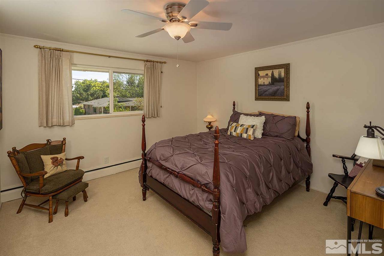1425 Marsh Avenue Reno, NV 89509 - Photo 24 of 40 a bedroom with a bed and a window