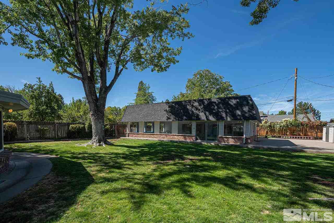 1425 Marsh Avenue Reno, NV 89509 - Photo 30 of 40 a front view of a house with a garden