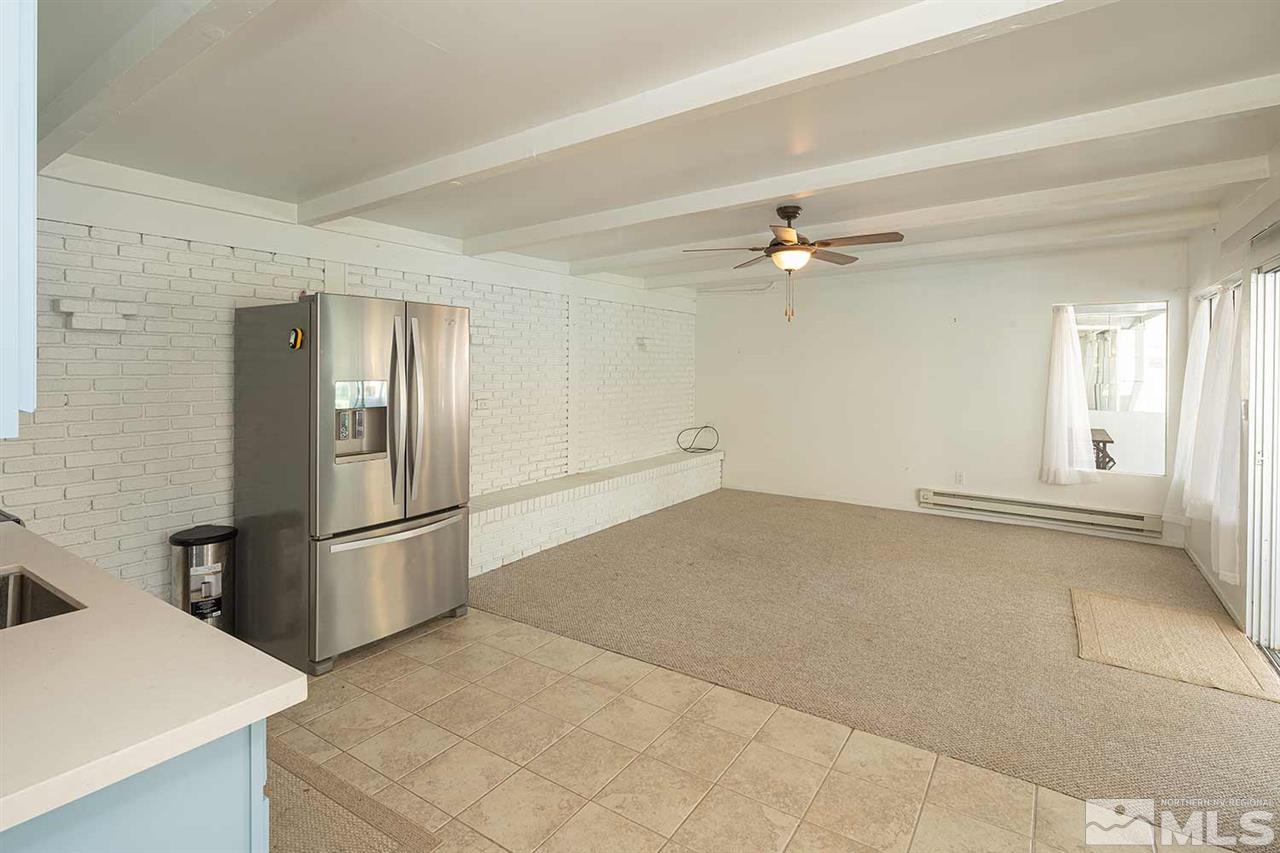 1425 Marsh Avenue Reno, NV 89509 - Photo 31 of 40 a view of a kitchen with a sink and a refrigerator