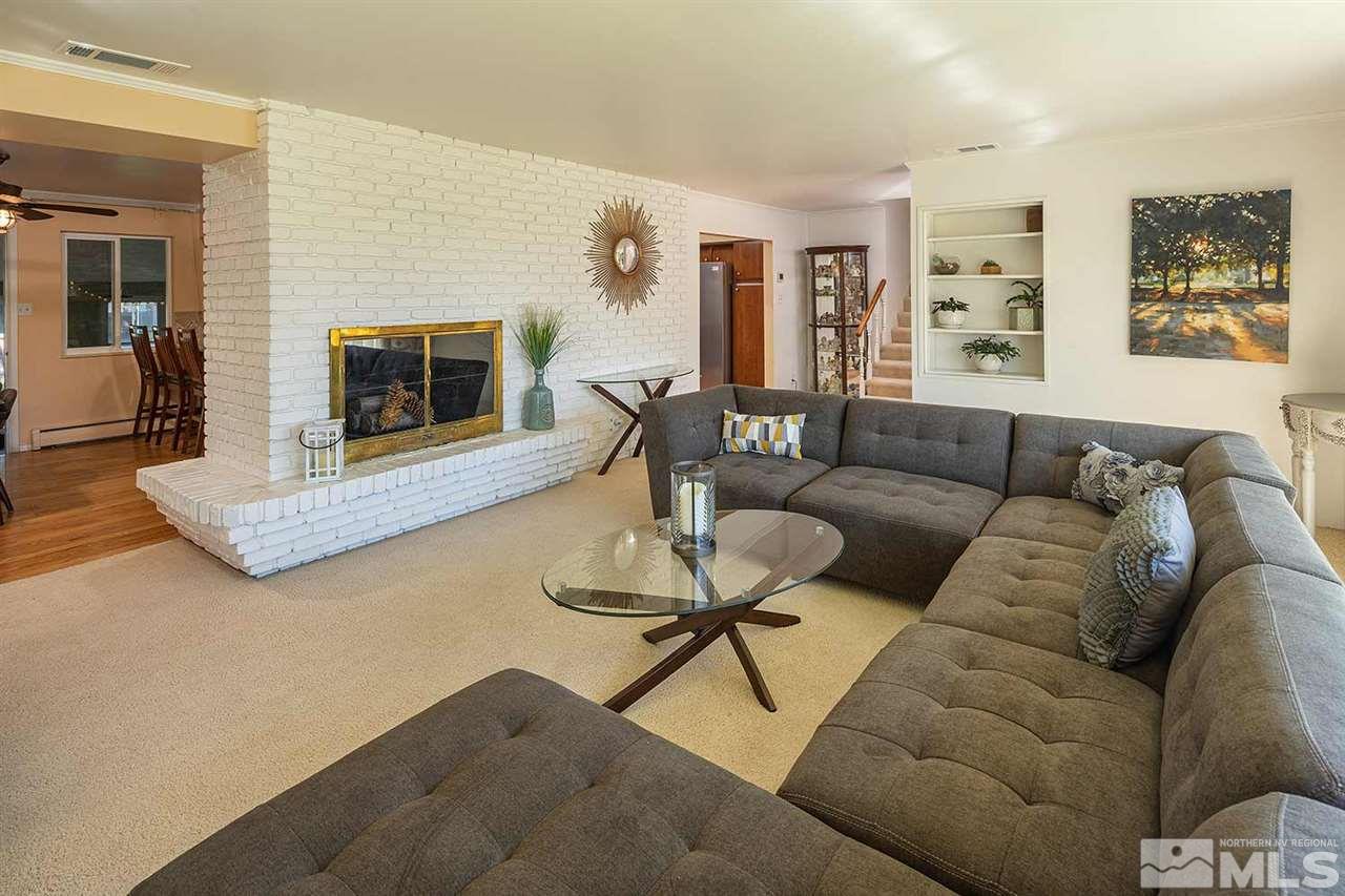 1425 Marsh Avenue Reno, NV 89509 - Photo 8 of 40 a living room with furniture and a fireplace