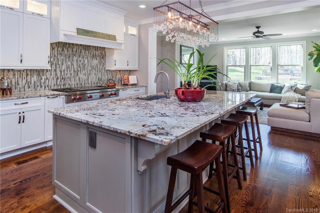210 Patternote Road, Unit 31 Mooresville, NC 28117 - Photo 6 of 29 a kitchen with a table and chairs in it