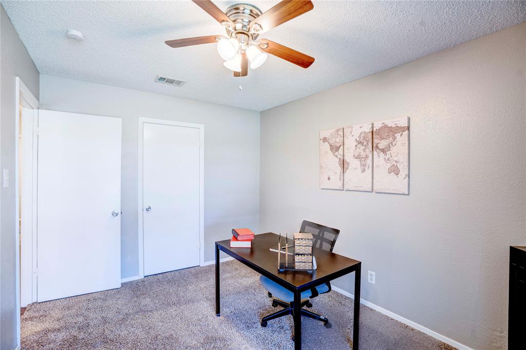 6028 Ridgecrest Drive Watauga, TX 76148 - Photo 24 of 40 a view of a room with furniture and a chandelier fan