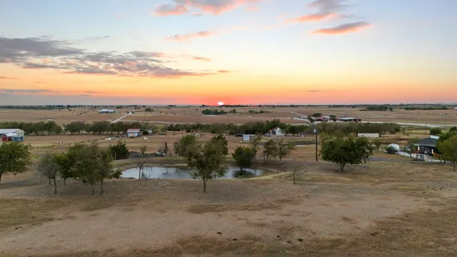 a view of swimming pool with outdoor seating
