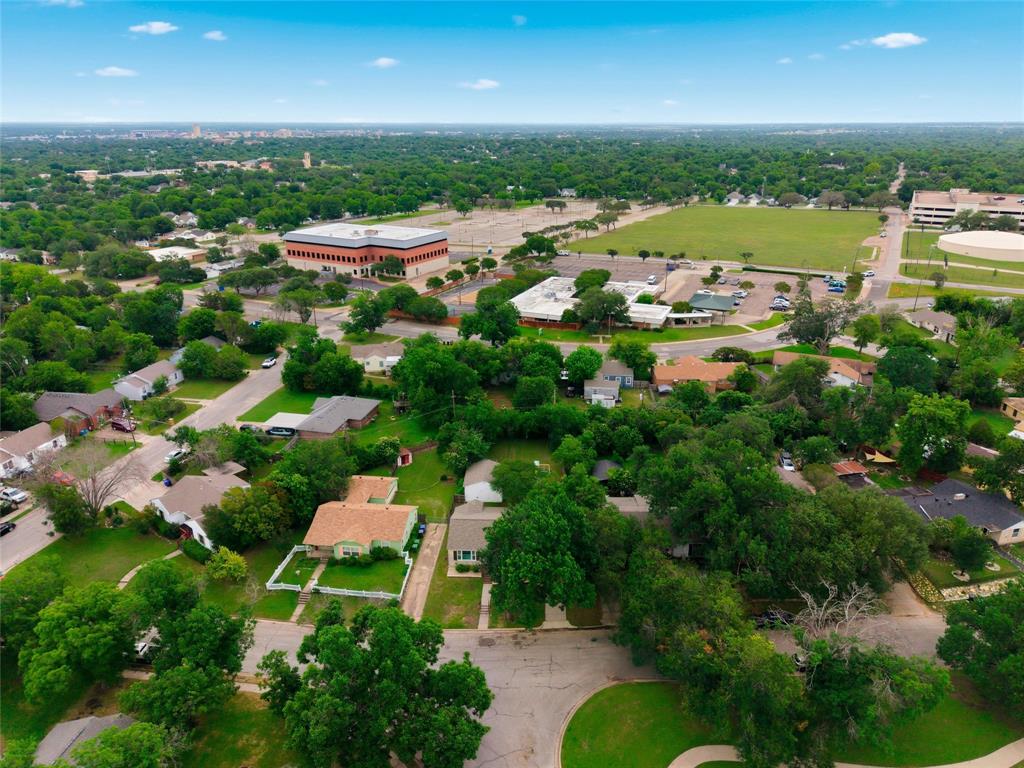 3012 Mitchell Avenue Waco, TX 76708 - Photo 17 of 18 Expansive neighborhood with mature tree coverage, residential streets, and nearby community buildings