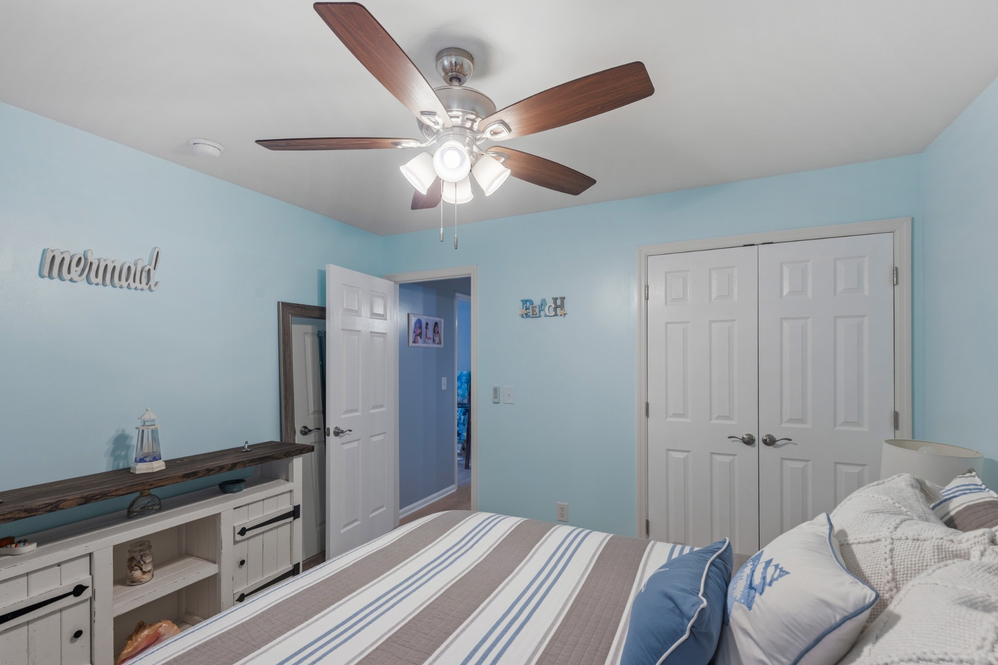454 Campbell Hollow Road Bethpage, TN 37022 - Photo 37 of 57 a bedroom with a bed and a chandelier