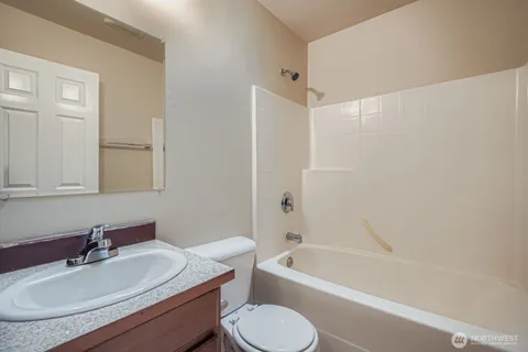 a bathroom with a sink toilet a bathtub and a vanity