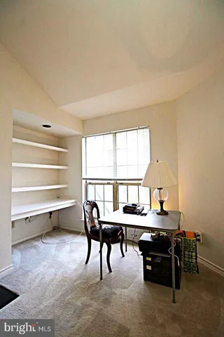 a room with furniture and a window