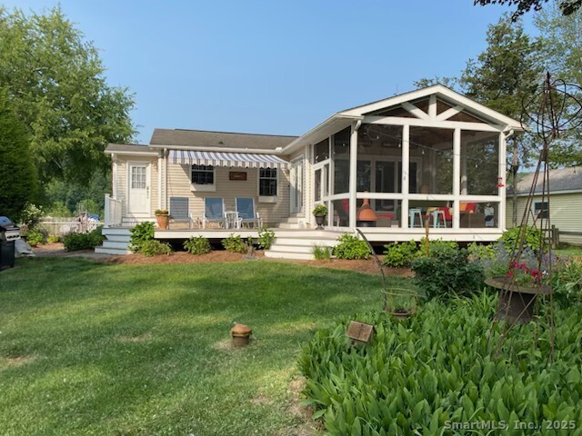 3 Conn River Road East Haddam, CT 06423 - Photo 1 of 22 a front view of a house with a garden and trees