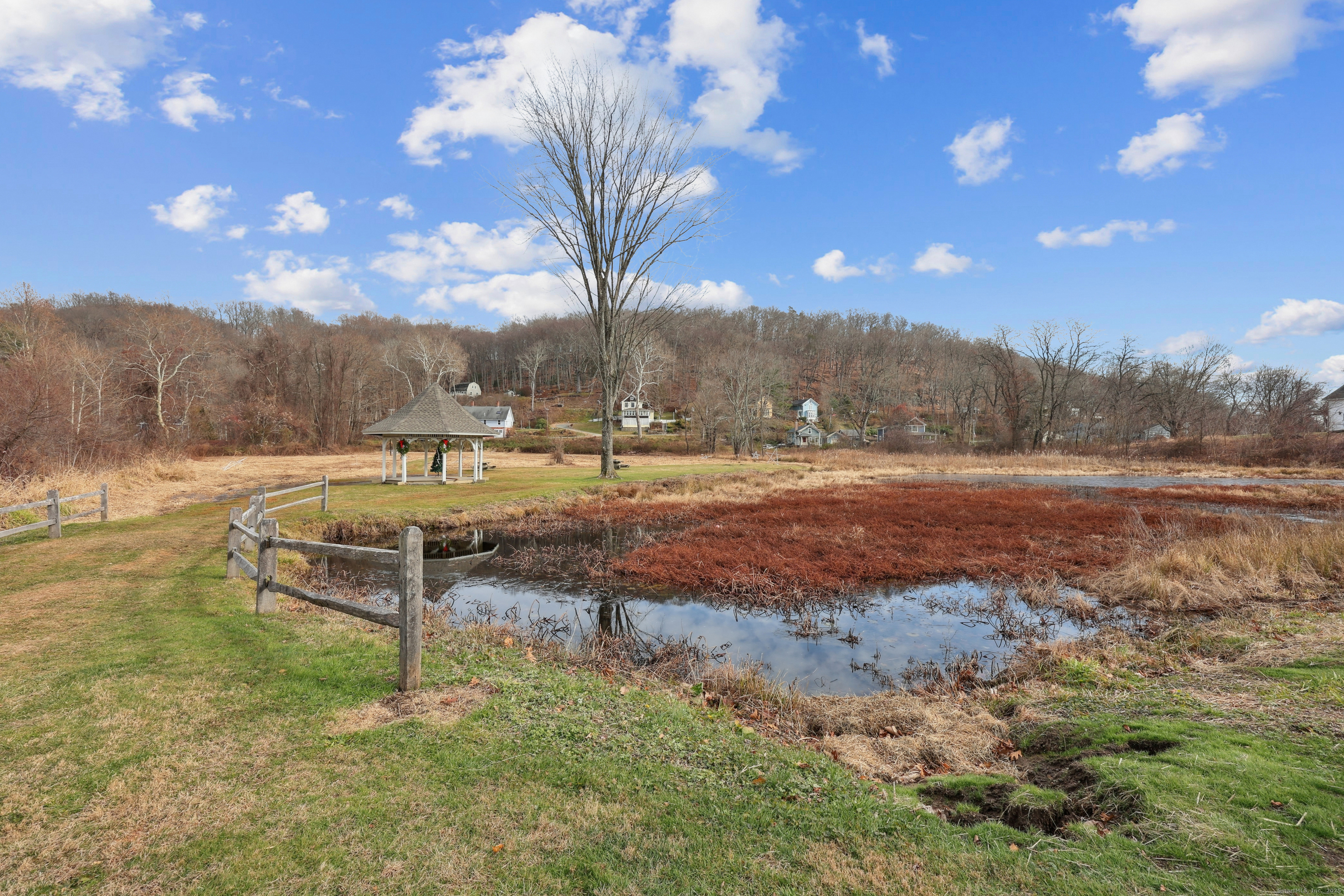 3 Conn River Road East Haddam, CT 06423 - Photo 18 of 22 a backyard of a house with table and chairs