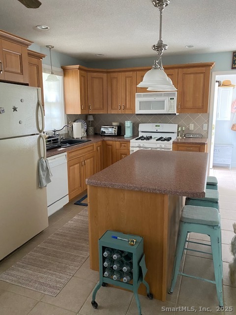 3 Conn River Road East Haddam, CT 06423 - Photo 7 of 22 a kitchen with stainless steel appliances granite countertop a refrigerator a stove and a sink