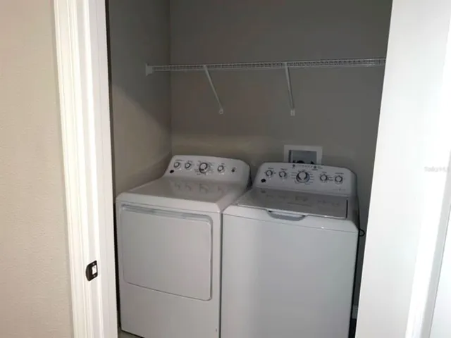 a utility room with dryer and washer