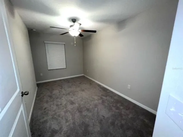 wooden floor in an empty room with a mirror