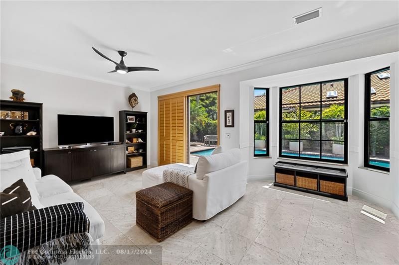 23285 Mirabella Circle Boca Raton, FL 33433 - Photo 13 of 31 a living room with furniture and a flat screen tv