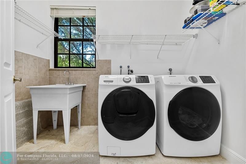 23285 Mirabella Circle Boca Raton, FL 33433 - Photo 16 of 31 a utility room with dryer and washer