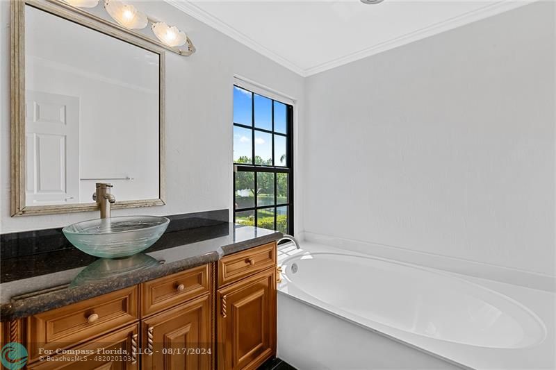 23285 Mirabella Circle Boca Raton, FL 33433 - Photo 19 of 31 a bath room with sink and mirror