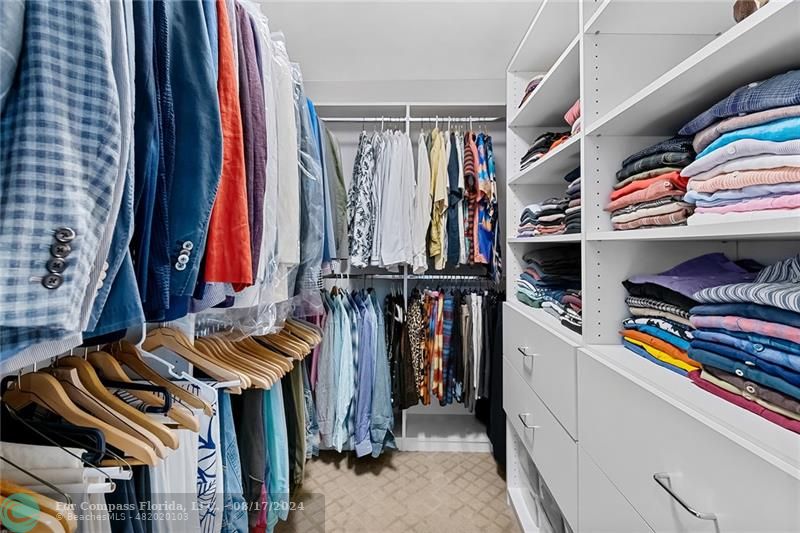 23285 Mirabella Circle Boca Raton, FL 33433 - Photo 21 of 31 a view of walk in closet with clothes and shoes