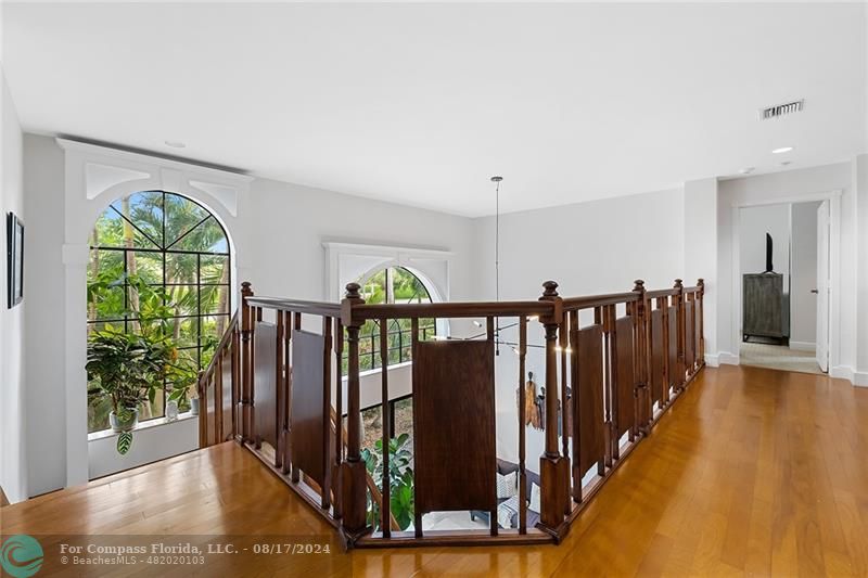 23285 Mirabella Circle Boca Raton, FL 33433 - Photo 22 of 31 a view of staircase with lots of wooden floor and windows