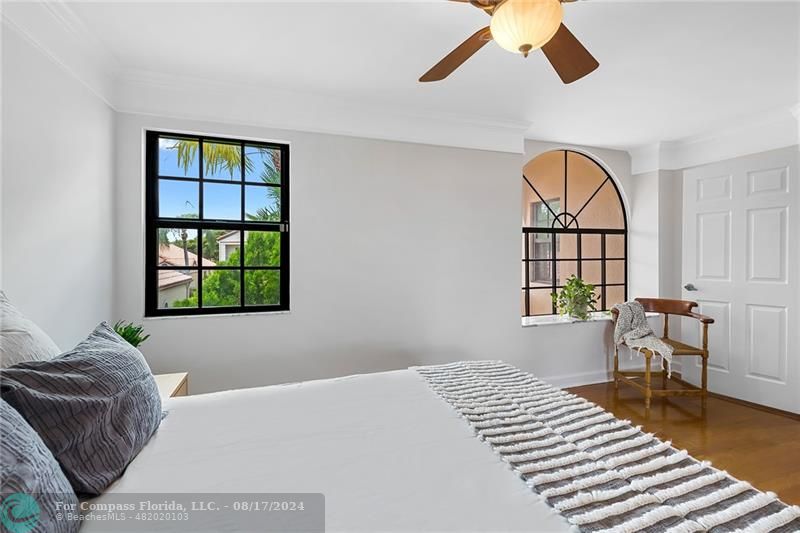 23285 Mirabella Circle Boca Raton, FL 33433 - Photo 28 of 31 a bedroom with a bed and a large window