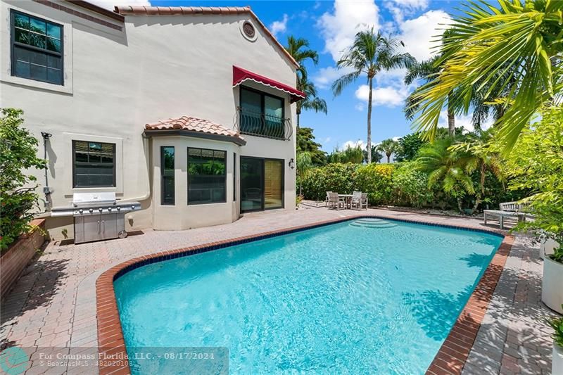 23285 Mirabella Circle Boca Raton, FL 33433 - Photo 30 of 31 a swimming pool with outdoor seating and yard