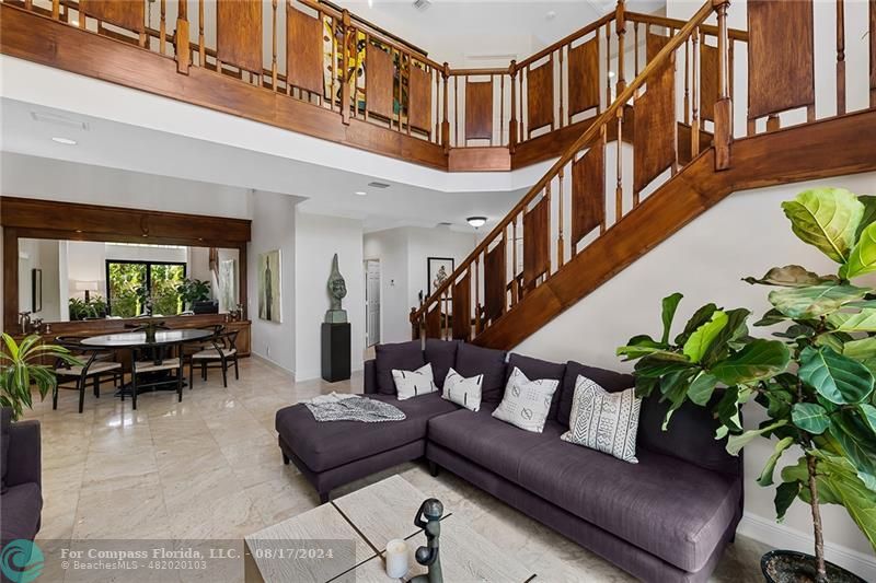 23285 Mirabella Circle Boca Raton, FL 33433 - Photo 7 of 31 a living room with furniture staircase and a potted plant