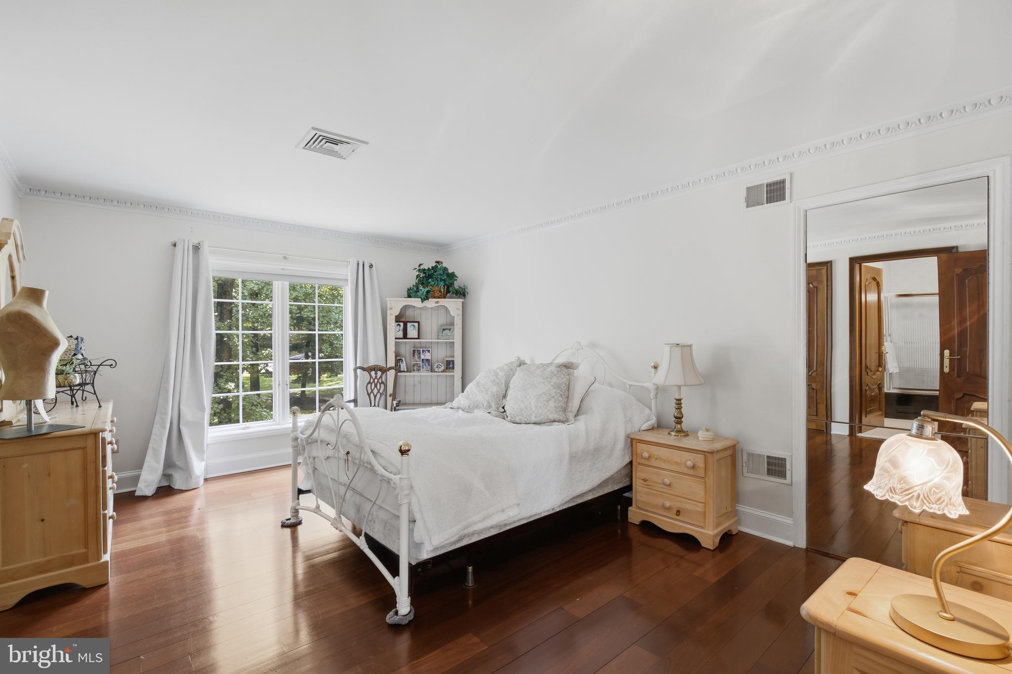 1733 Stocton Road Jenkintown, PA 19046 - Photo 65 of 149 a spacious bedroom with a bed and wooden floor