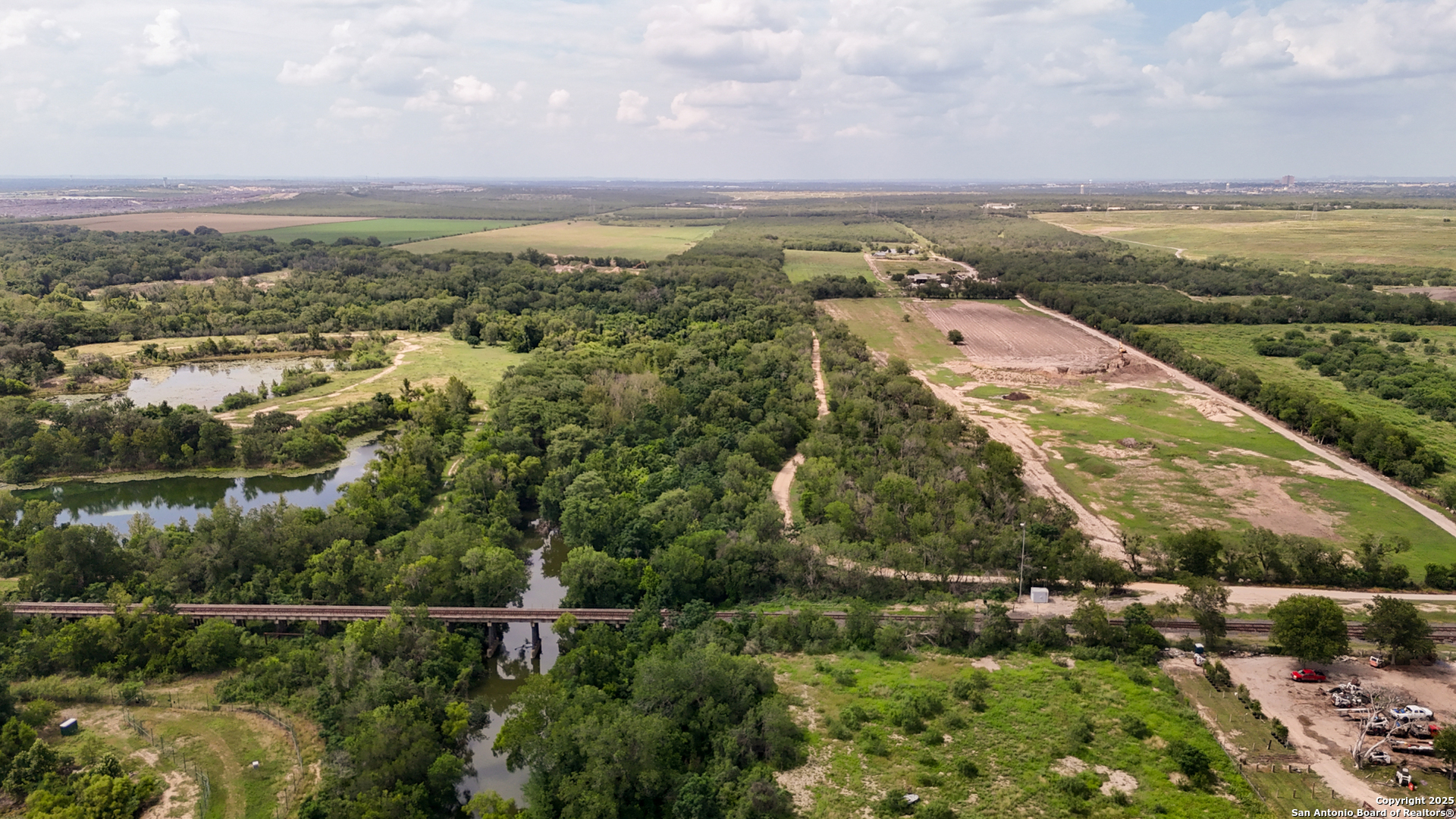 9217 Nelson Road San Antonio, TX 78252 - Photo 1 of 10 an aerial view of residential building and lake