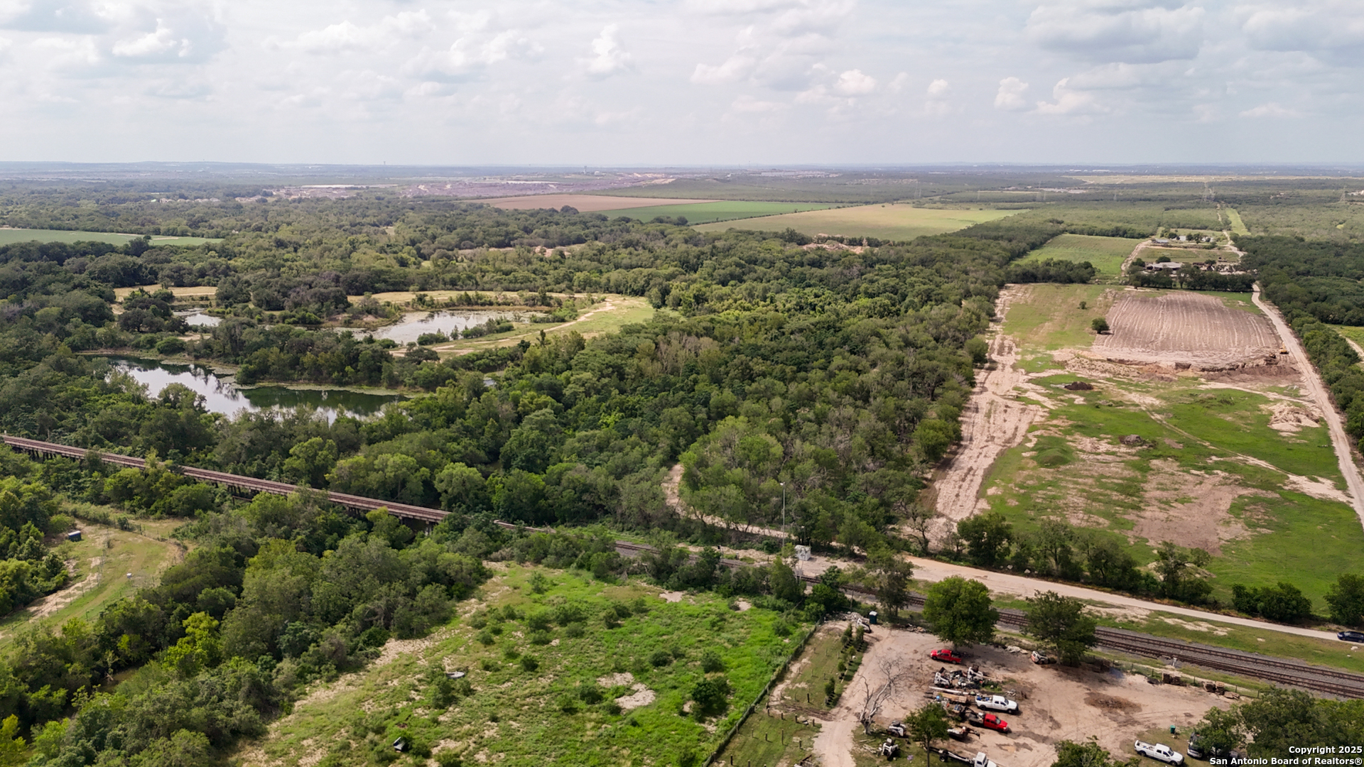 9217 Nelson Road San Antonio, TX 78252 - Photo 2 of 10 an aerial view of residential building and green space