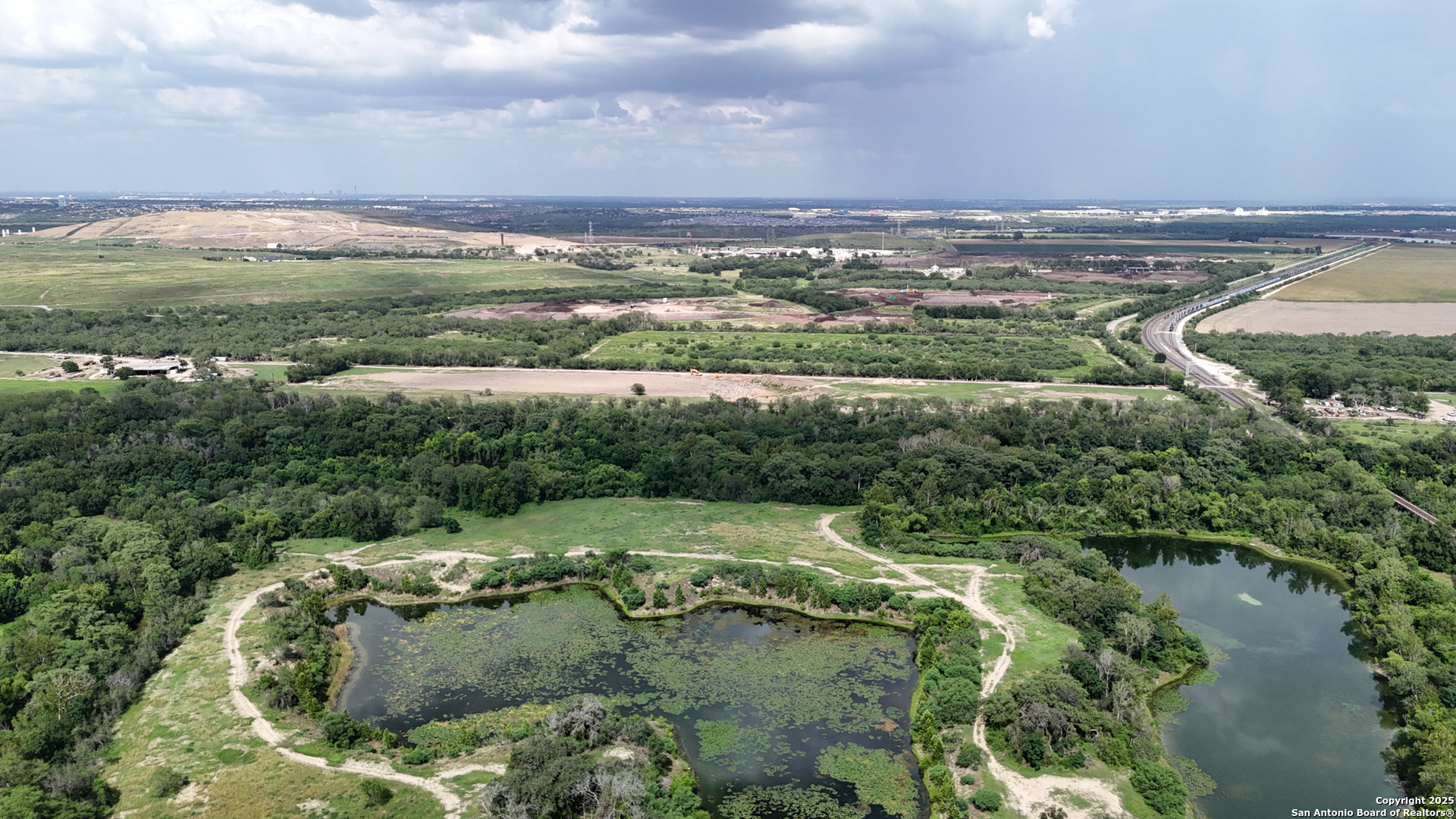 9217 Nelson Road San Antonio, TX 78252 - Photo 4 of 10 a view of a city with mountains in the background