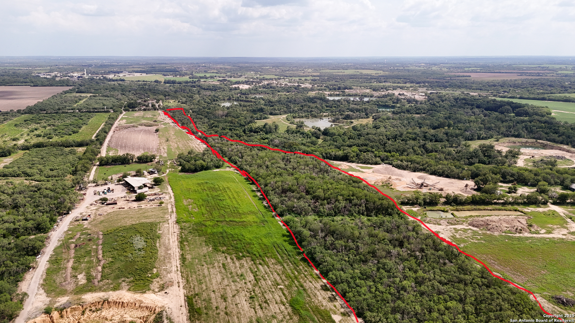9217 Nelson Road San Antonio, TX 78252 - Photo 5 of 10 an aerial view of a house with a garden