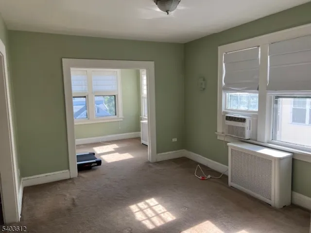 a room with gym equipment and a window