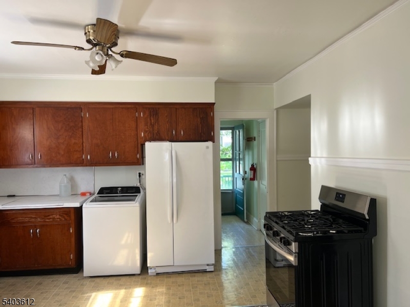 12 John Street Summit, NJ 07901 - Photo 6 of 7 a kitchen with a refrigerator stove and cabinets
