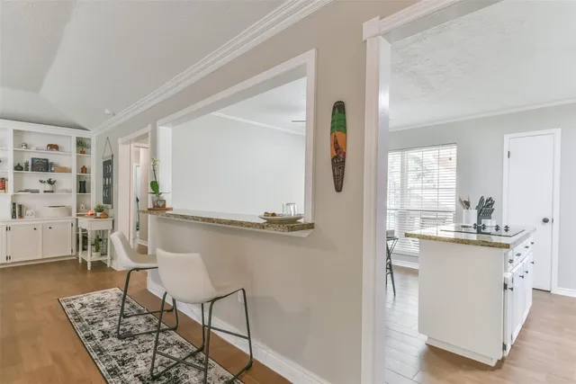a kitchen with a sink cabinets and window