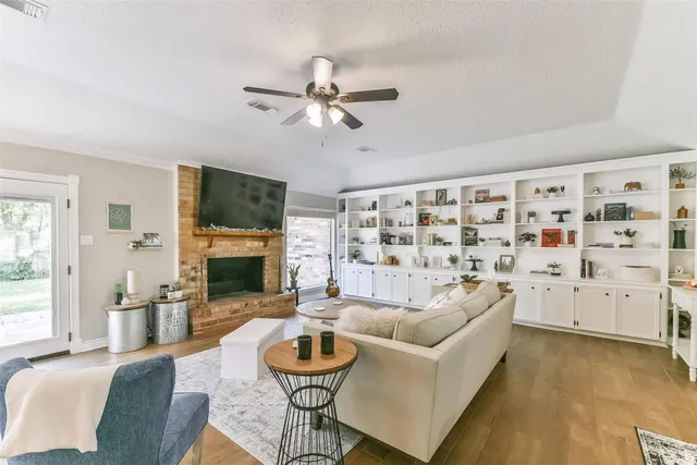 a living room with lots of furniture and a chandelier
