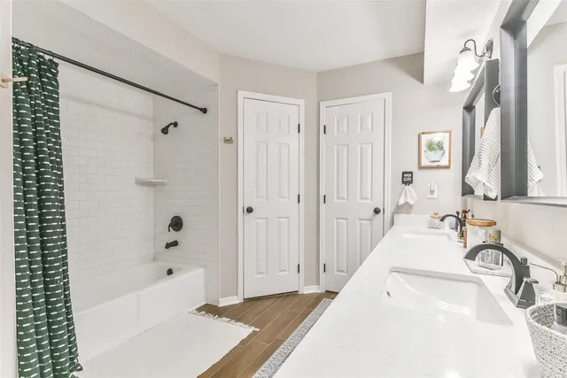 a bathroom with a bathtub and a sink