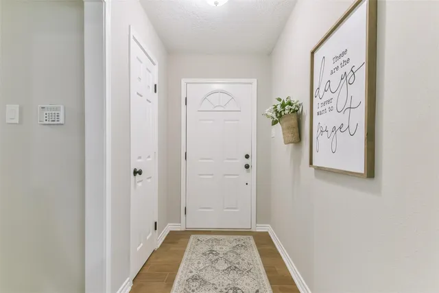 a view of a hallway with entryway