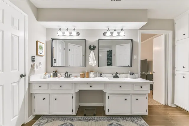 a bathroom with a bathtub and a sink