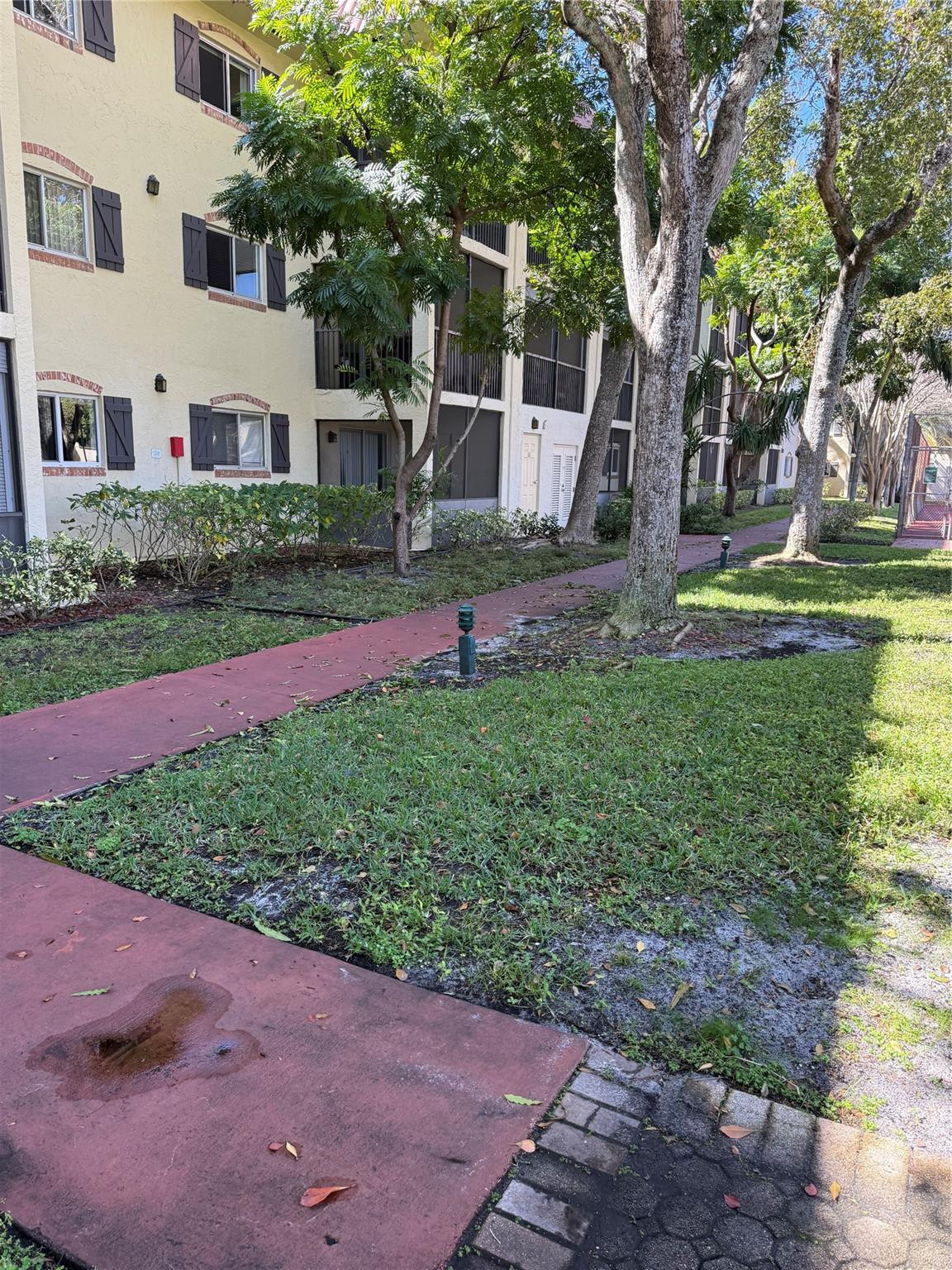 255 South Cypress Road, Unit 323 Pompano Beach, FL 33060 - Photo 11 of 11 a view of a house with a yard