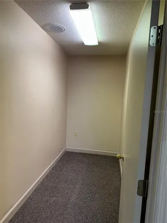 an empty room with a hallway