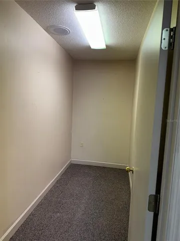 an empty room with a hallway