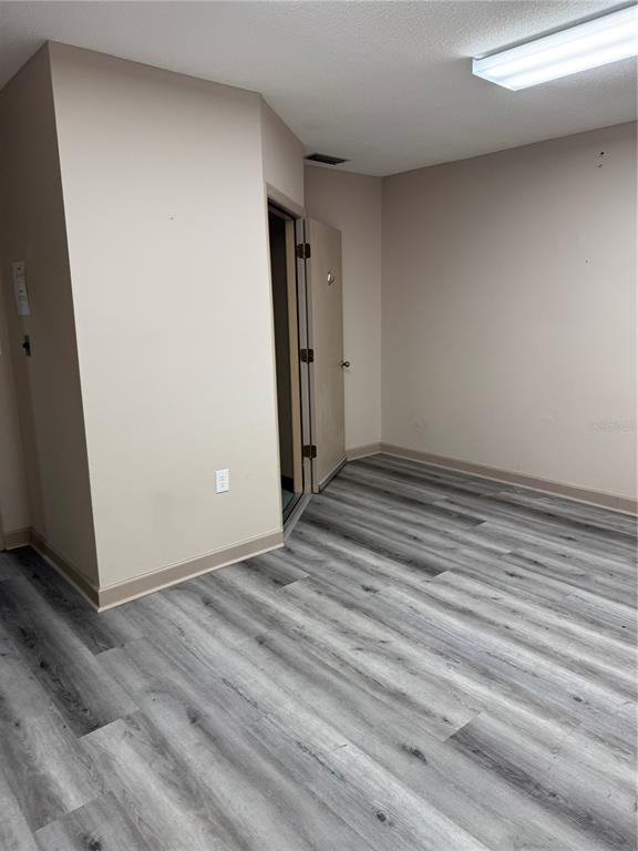 17 Northwest 33rd Court Gainesville, FL 32607 - Photo 14 of 14 a view of a room with wooden floor