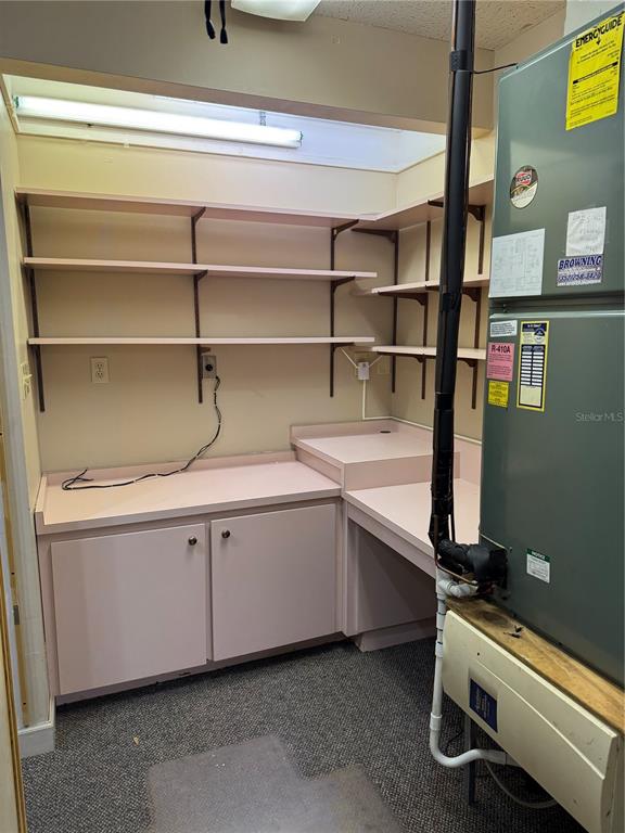 17 Northwest 33rd Court Gainesville, FL 32607 - Photo 5 of 14 a room with a wooden floor and furniture