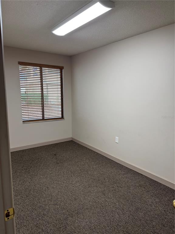 17 Northwest 33rd Court Gainesville, FL 32607 - Photo 10 of 14 an empty room with a window