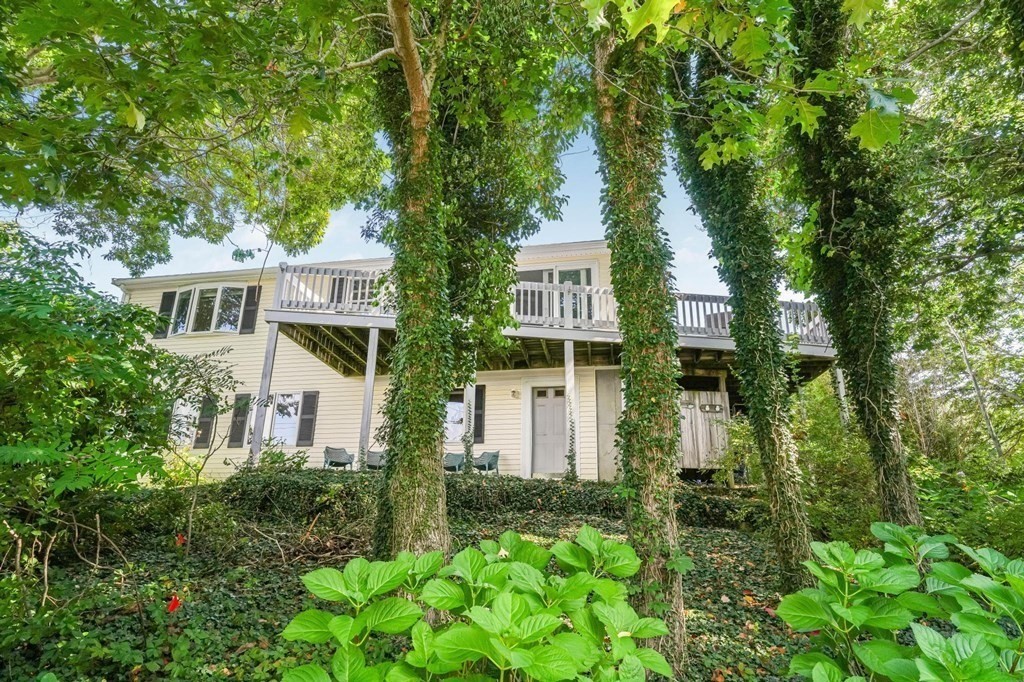 front view of a house with a tree