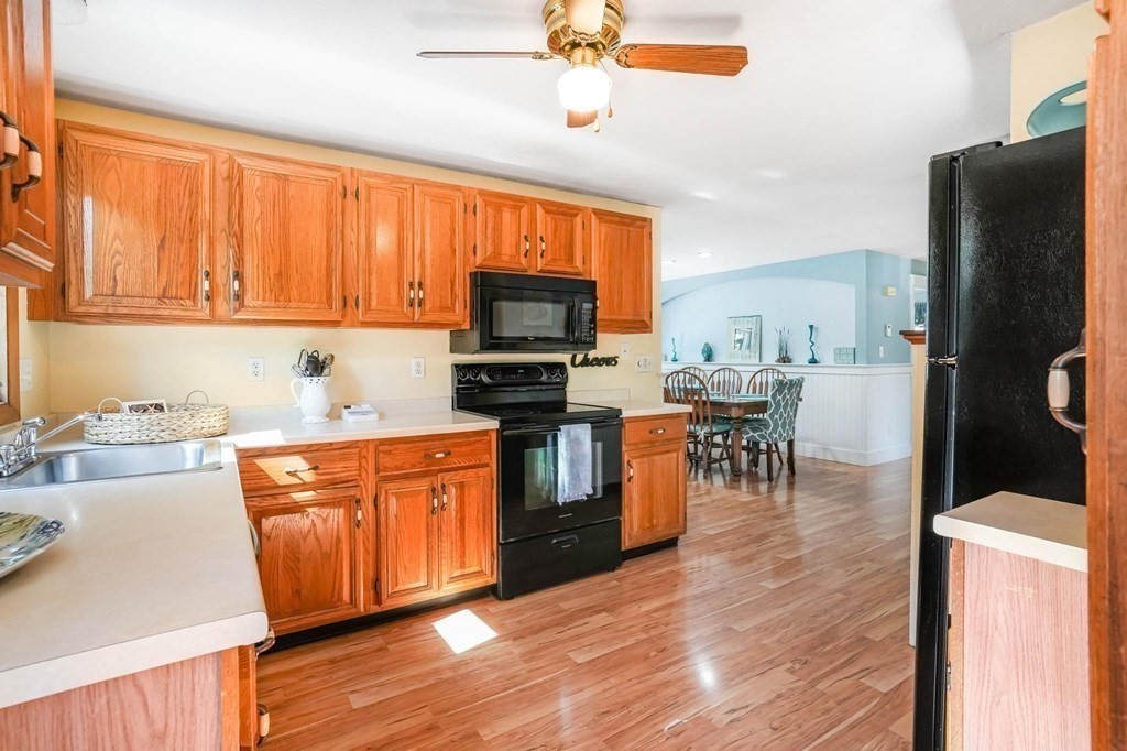 24 Jae Road Falmouth, MA 02556 - Photo 13 of 32 a kitchen with stainless steel appliances a stove top oven and a refrigerator