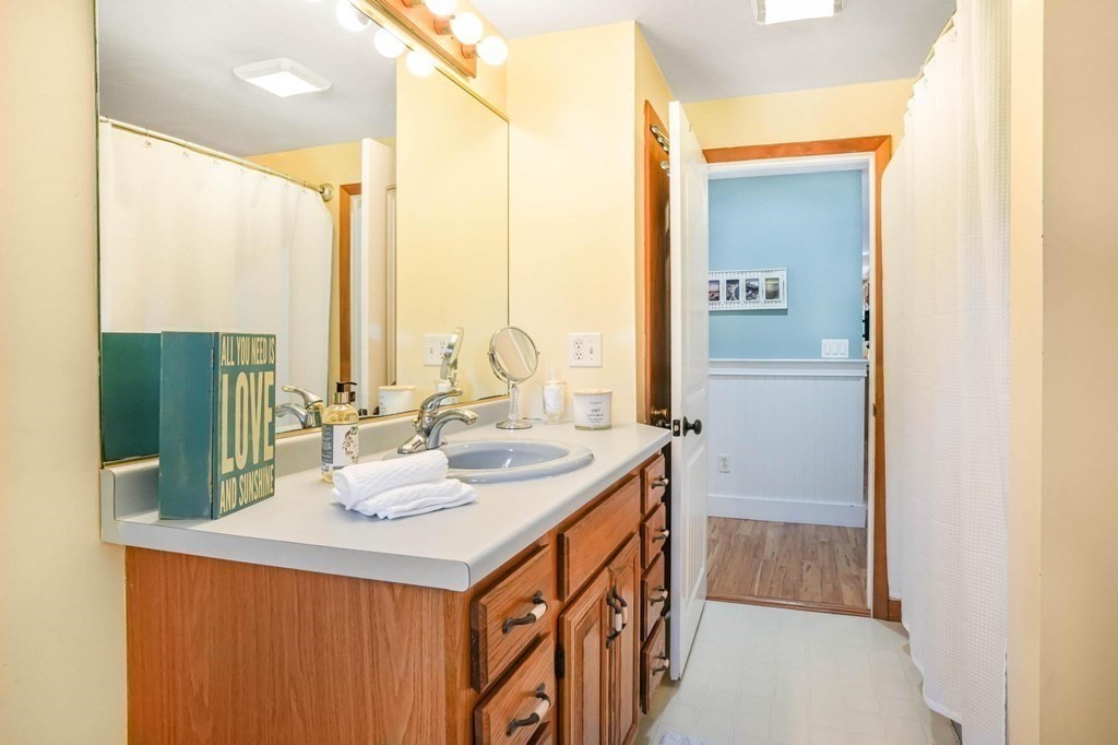 24 Jae Road Falmouth, MA 02556 - Photo 23 of 32 a bathroom with a double vanity sink and a mirror