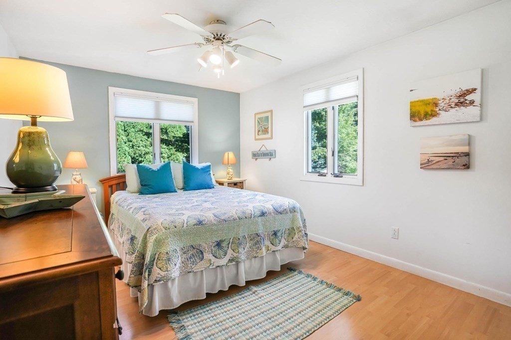 24 Jae Road Falmouth, MA 02556 - Photo 24 of 32 a bedroom with a bed a window and lamps