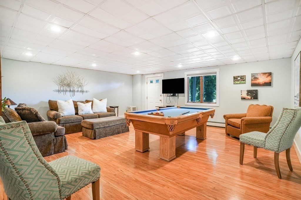 24 Jae Road Falmouth, MA 02556 - Photo 28 of 32 a living room with furniture a rug and a flat screen tv